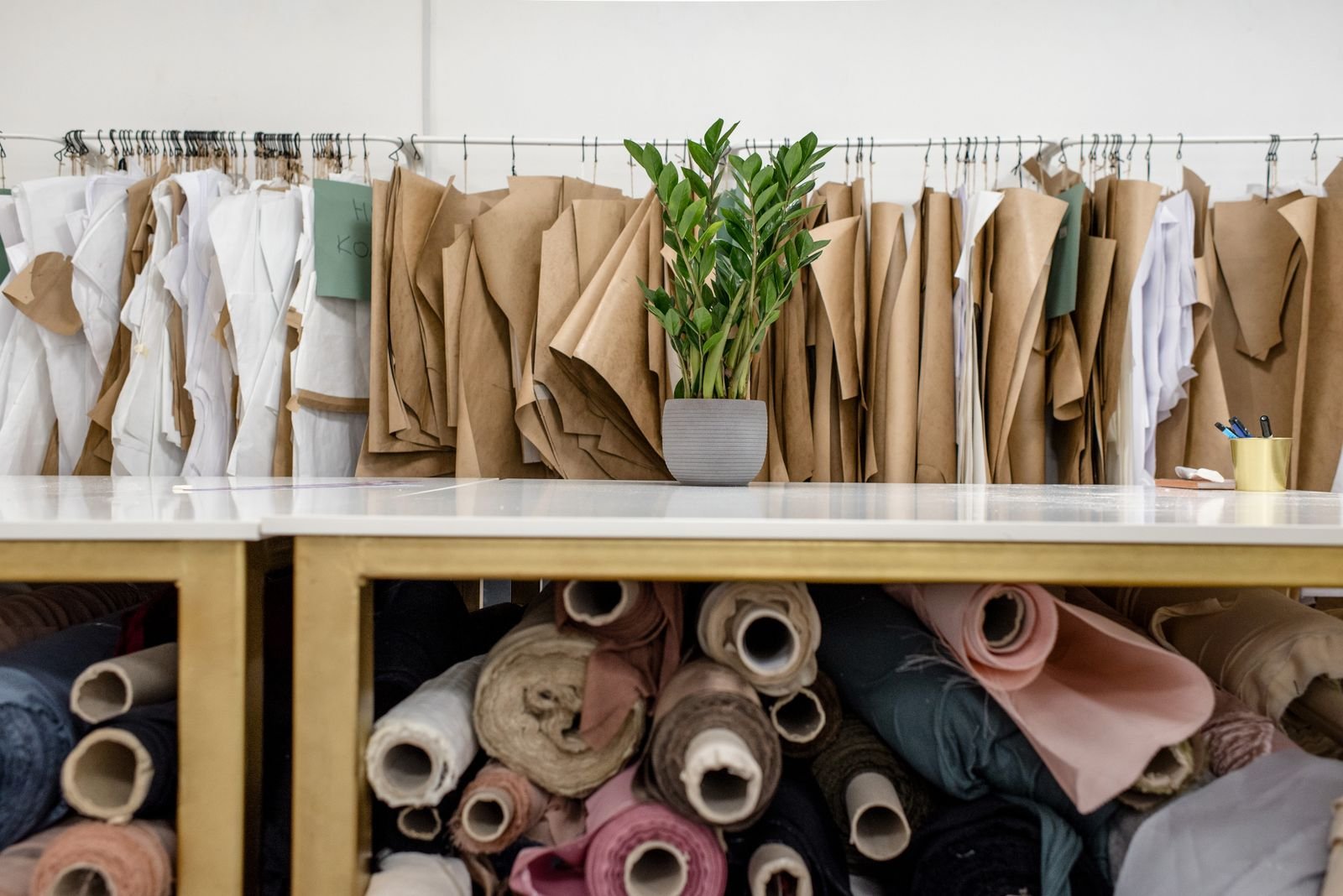 Fabric rolls and garment patterns in a uniform workshop